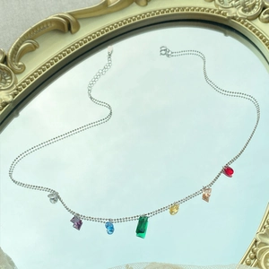 S925 sterling silver necklace with vibrant rainbow zircon pendants on a mirror surface