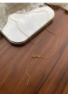 Close-up of S925 sterling silver gold chain with adjustable needle and spring clasp