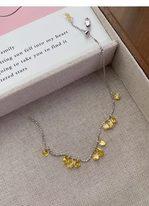 Detail view of S925 sterling silver slider bracelet with yellow teardrop-cut cubic zirconia