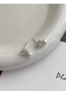Close-up of S925 silver stud earrings with square zircon and white freshwater pearl