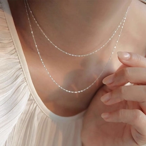 S925 sterling silver minimalist double layer star chain necklace on model neck