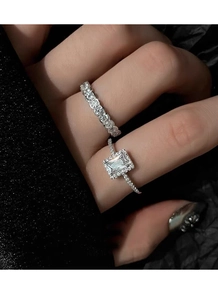Macro shot of S925 sterling silver halo rectangular ring and matching eternity band set