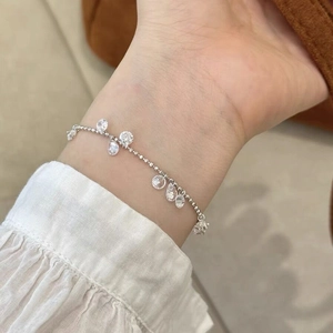 S925 sterling silver pull-out bracelet with yellow zircon charms on female wrist