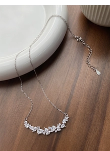Macro shot of S925 sterling silver stamp on the Wisteria flower zircon necklace clasp