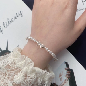 Bracelet en perles et argent S925 avec pendentifs nœuds élégants pour femme