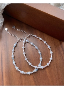 Detail of S925 silver clasp and heart pendant on freshwater pearl aquamarine bracelet