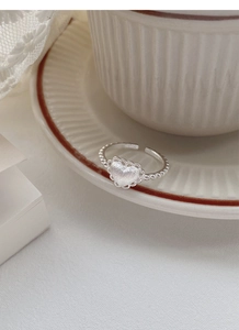 Detail of S925 sterling silver heart ring with frosted texture and delicate lace edges