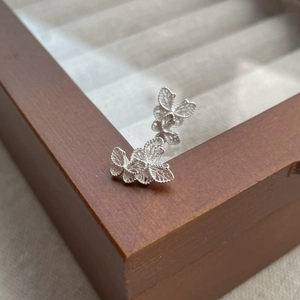 Elegant S925 sterling silver filigree butterfly stud earrings with hollow wings detail