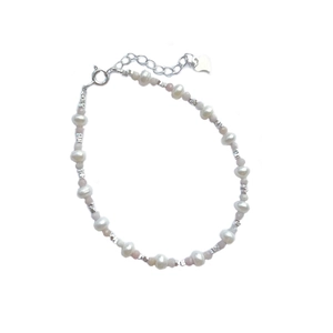 Handmade S925 silver bracelet with freshwater pearls and blue gems on a white background