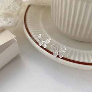 Minimalist S925 sterling silver butterfly stud earrings with matte brushed finish texture