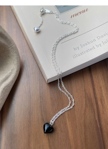 Detail of S925 sterling silver chain with black heart pendant and adjustable toggle