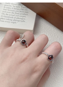 S925 silver beaded flower ring with red garnet and a small lucky pendant detail