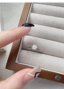Detailed view of an adjustable S925 silver snowflake ring with white zircon stones