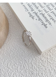 Close-up of S925 sterling silver snowflake ring with sparkling micro-set crystals