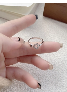 Detailed close-up showing S925 hallmark on minimalist silver hollow heart open ring