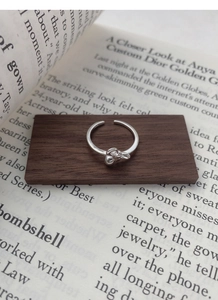 Detailed close-up of S925 sterling silver bow knot bead ring with adjustable open band
