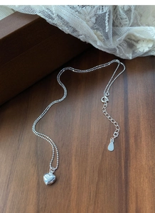 Detailed view of S925 sterling silver ball chain necklace with polished 3D heart pendant