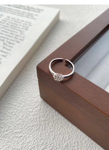 Close-up of S925 sterling silver snowflake ring with adjustable band and micro-inlays