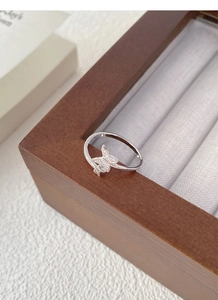 Detailed close-up of S925 sterling silver butterfly ring with sparkling zircon stones