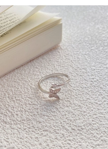 Macro detail of S925 sterling silver stamp on the double butterfly open ring