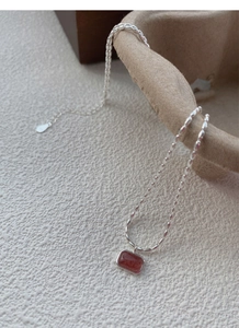 Detailed view of S925 sterling silver stamp on the strawberry quartz pendant necklace