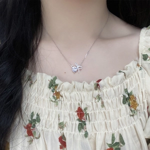 Elegant S925 sterling silver bow and heart necklace with sparkling white zircons for women