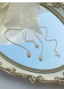 Detailed close-up showing the S925 silver hallmark on an elegant oval opal stone necklace