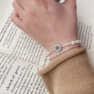 Bracelet élégant en argent S925 avec aigue-marine bleue, perles et un design à double couche