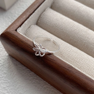 Elegant S925 sterling silver hollow flower open ring displayed in a luxury jewelry box