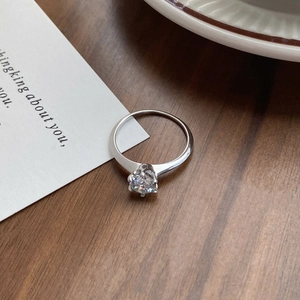 Classic six-prong sterling silver moissanite ring with a brilliant round cut stone