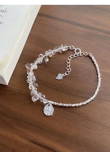 Detail of S925 silver bracelet with irregular crystals and round charm with Chinese text