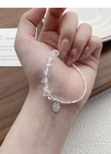 Detail view of S925 sterling silver bracelet with irregular clear crystal stones on wrist