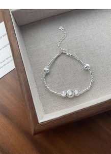 Detailed close-up of S925 sterling silver beaded bracelet with lobster clasp and extension