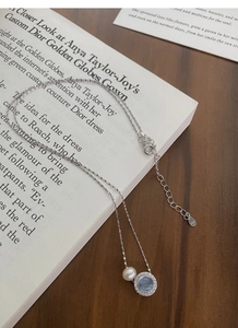 Macro view of S925 sterling silver necklace with freshwater pearl and aquamarine detail