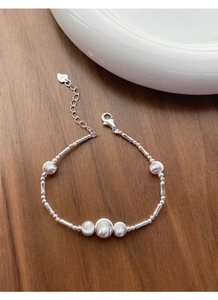 Detail of S925 sterling silver beaded bracelet with lobster clasp and heart tag stamp