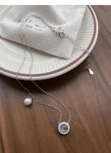 Macro shot of S925 sterling silver stamp on the delicate pearl necklace clasp