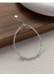 Detail of silver pearl bracelet with star pendant, S925 silver beads and heart tag