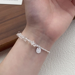 S925 sterling silver bracelet featuring clear crystal stones and luck charm on model