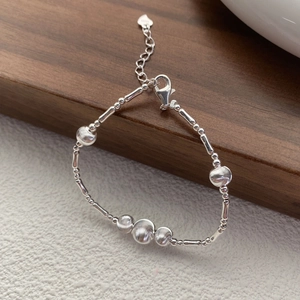 Elegant S925 sterling silver beaded bracelet with bamboo tubes and a small heart charm