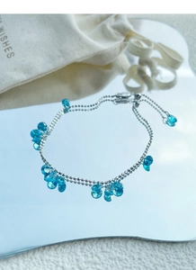 Detailed close-up of double-layer S925 silver bracelet with blue teardrop crystals