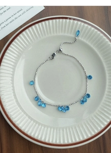 Detail view of 925 sterling silver bracelet with blue teardrop zircon and adjustable clasp