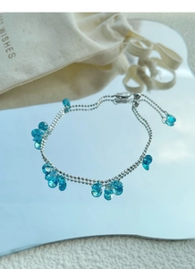 Detail of blue crystal drop bracelet with adjustable silver chain and sliding closure