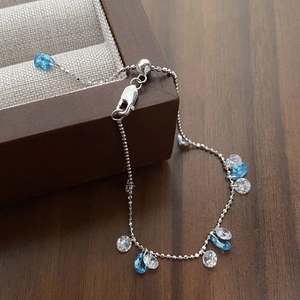 925 silver adjustable slider bracelet with blue zircon stones and dangling pear-cut gems