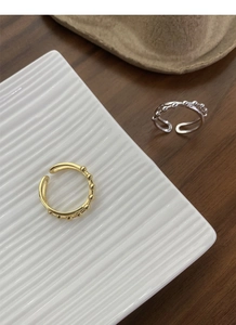 Detail view of S925 sterling silver double layer open rings in gold and silver finishes