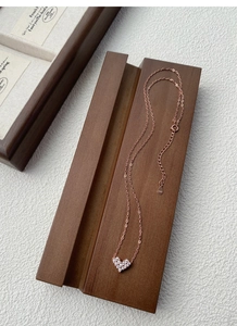 Detail view of S925 sterling silver heart necklace featuring rose gold plating and white zircons