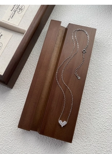 Detailed close-up of S925 sterling silver heart necklace with sparkling zircon stones