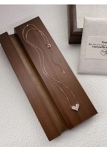 Detail of rose gold S925 sterling silver heart necklace with sparkling zircon pave