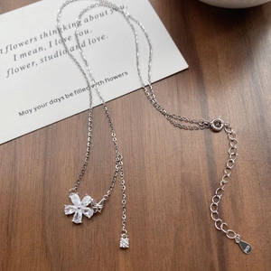 Elegant S925 sterling silver butterfly flower necklace with sparkling zircon on wood