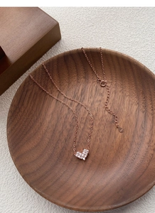 Detailed macro view of S925 sterling silver heart pendant with rose gold plating and zircon