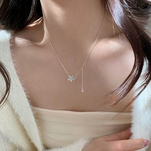Elegant S925 sterling silver flower pendant necklace with shimmering zircon tassels